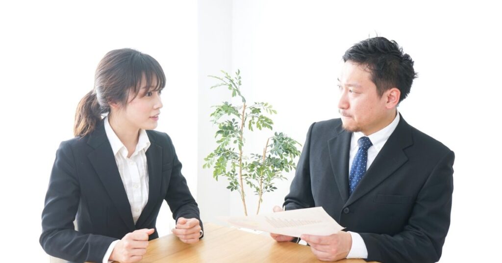 ALT: “mediator guiding borrower and creditor through debt negotiation process”)