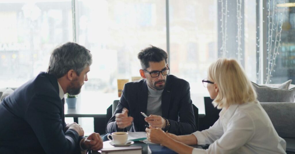 business mediator facilitating financial dispute resolution between partners