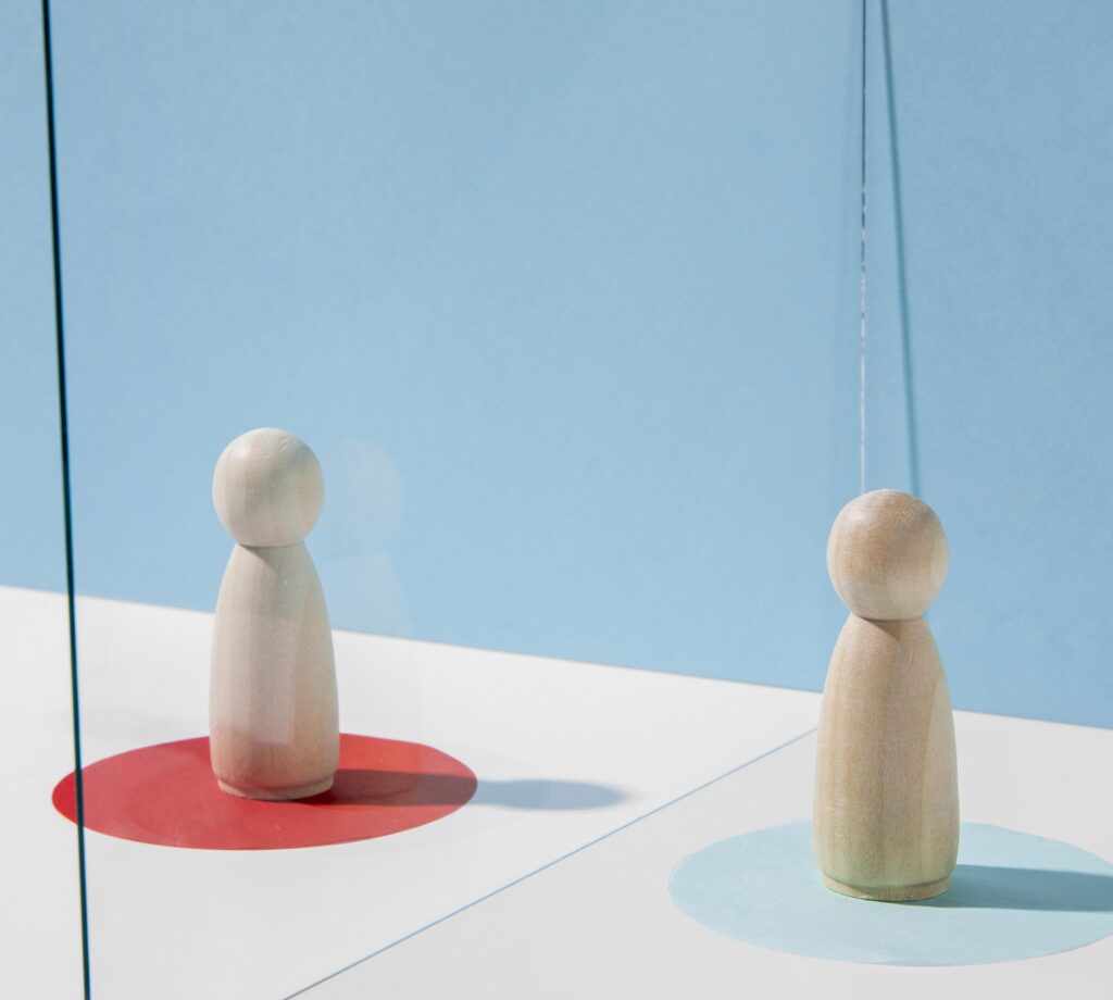 wooden pawns with glass divider coronavirus safety