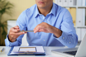 Person reviewing credit card debt options at a desk