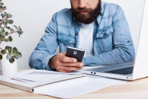 Person reviewing credit card account on a smartphone