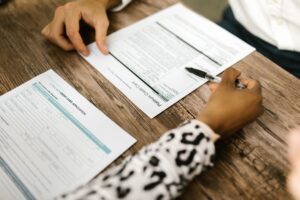 Close-up of a credit report document with a pen